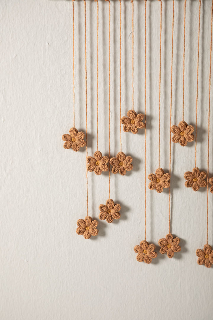 Handmade floral wall hanging for kids’ room
