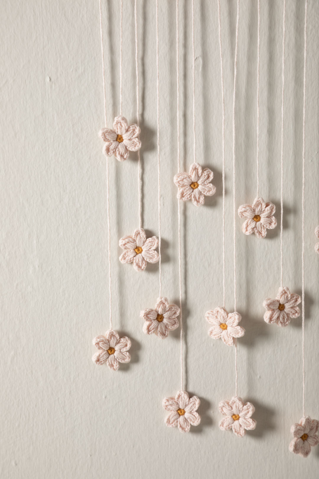 Scandinavian crochet wall hanging with flowers