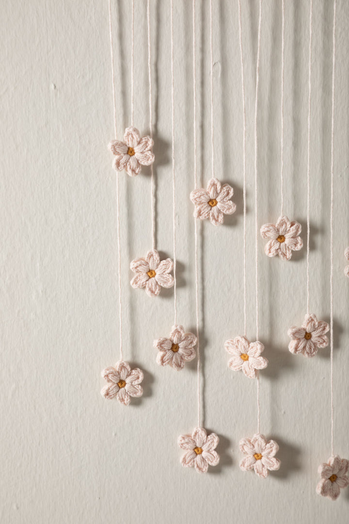 Scandinavian crochet wall hanging with flowers