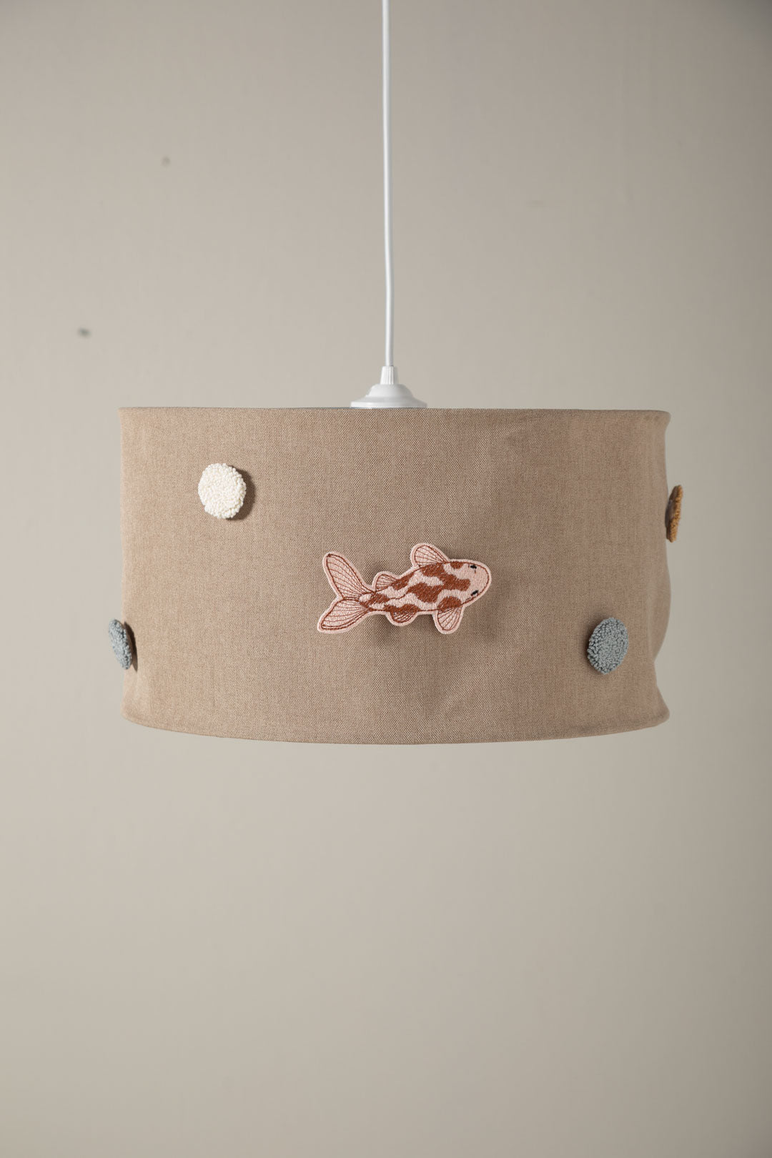 Interchangeable embroidered patches for Saga nursery lampshade